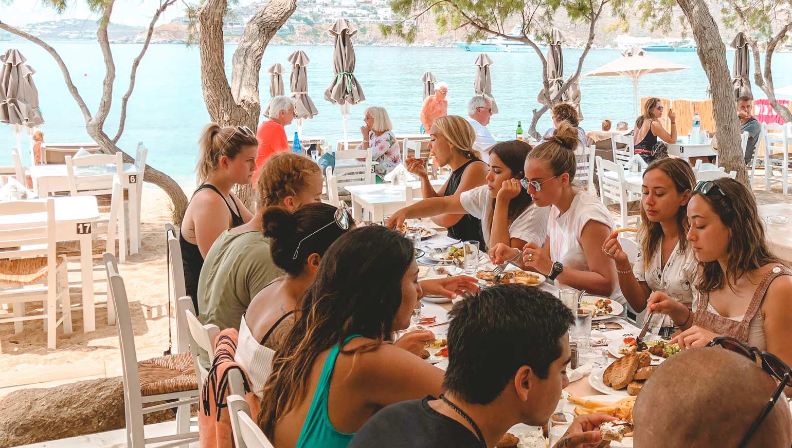 Mykonos retreat group lunch by the beach